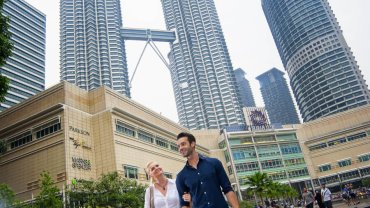 Couple seeing enjoying shopping at KLCC shopping mall Petronas Twin Towers, Kuala Lumpur, Malaysia