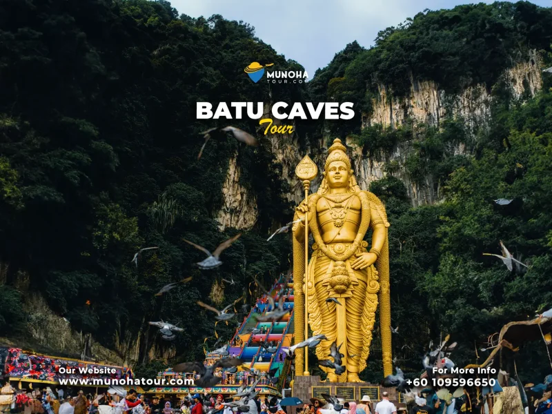 Batu Caves Private Tour, Visitors exploring the iconic during a private tour from Kuala Lumpur Malaysia, with the towering golden statue of Lord Murugan in the background.